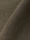 A close-up fabric swatch of the Brown Fine Organic Cotton Sal Road Shirt highlights the lightweight, loose weave of the 100% organic cotton. The image focuses on the rich brown color and the fine texture of the material.