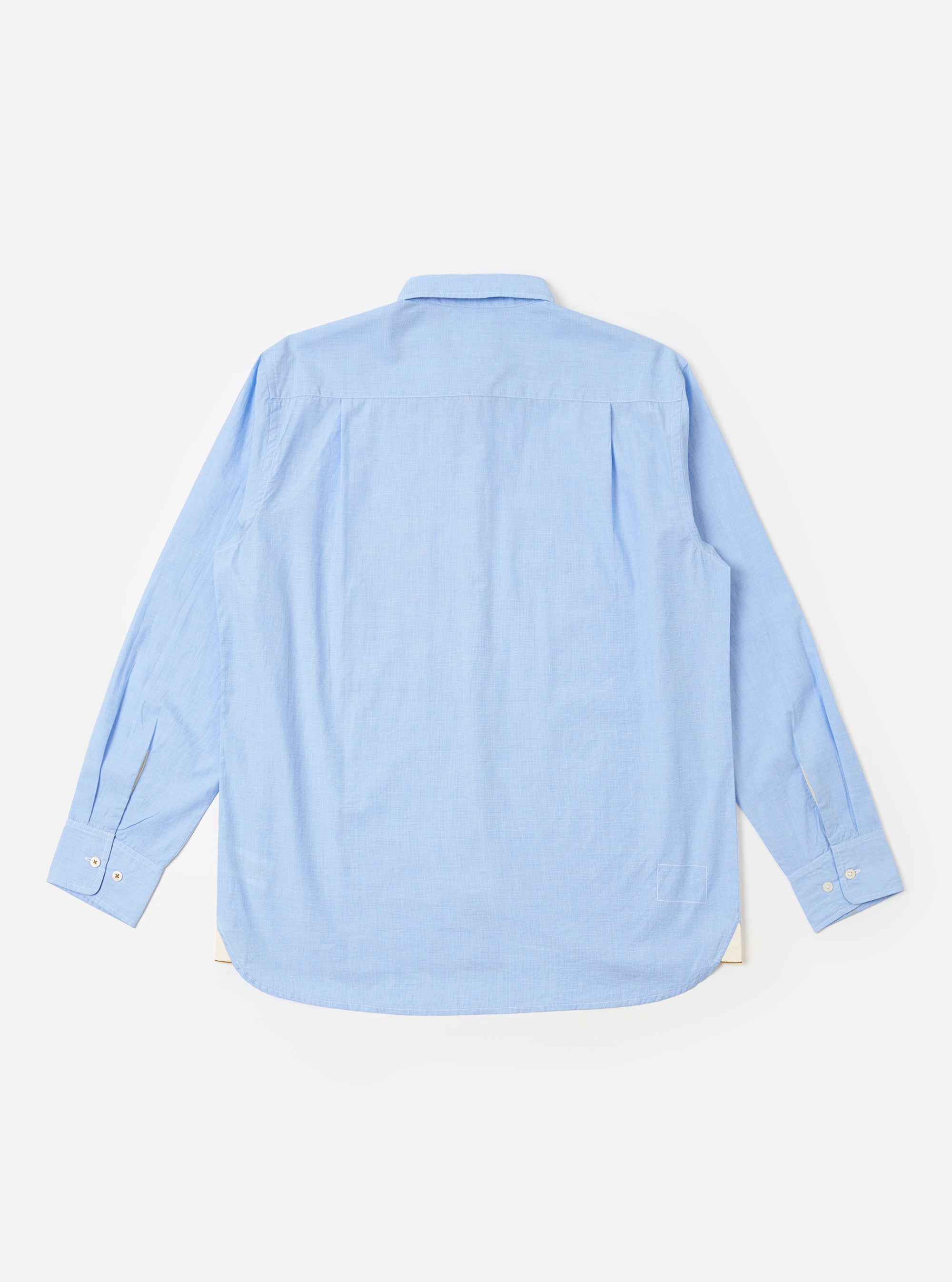 The Sky Fil A Fil Square Pocket Shirt is shown from the back as a flat lay against a white background. The shirt features a back yoke and a slightly curved hem. The fabric has a fine, end-on-end weave in a light sky blue color.