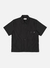 The Black Recycled Polytech Z Tech Overshirt is shown as a flat lay against a white background. The overshirt features a one-piece collar, a central button-down closure, and a visible zip-closure patch pocket on the left chest. The black recycled polytech fabric has a smooth finish.