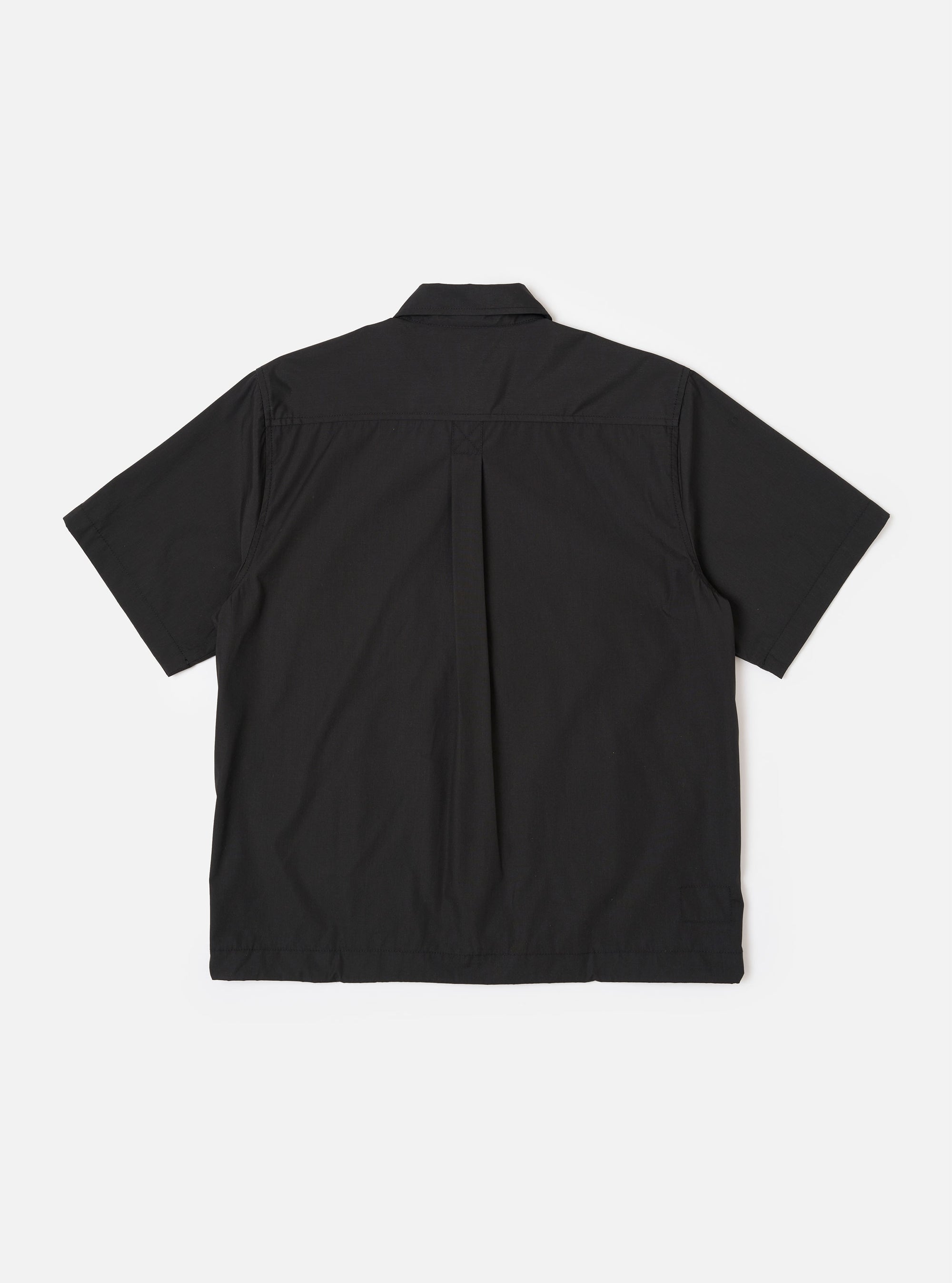 The Black Recycled Polytech Z Tech Overshirt is shown from the back as a flat lay against a plain white background. The image highlights the back yoke with a central box pleat and the smooth, technical texture of the black recycled fabric.