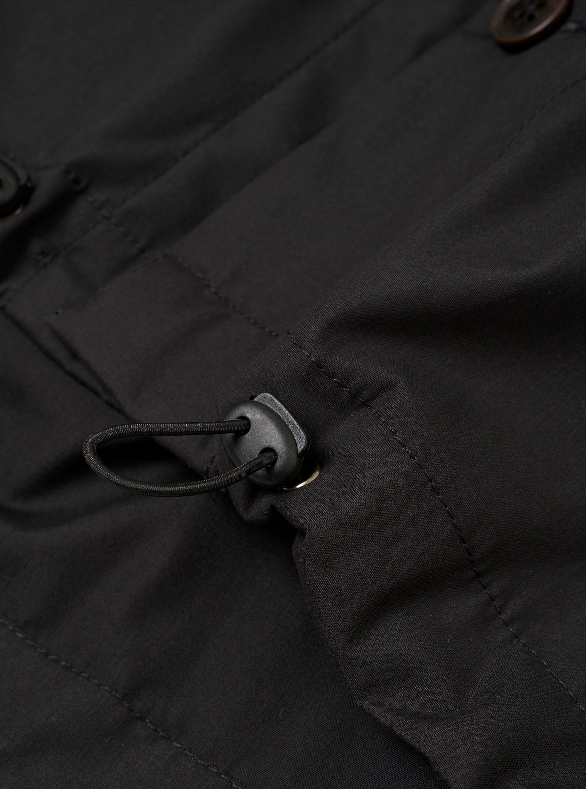 The Black Recycled Polytech Z Tech Overshirt is shown from the back as a flat lay against a plain white background. The image highlights the clean, simple construction of the garment's rear panel and the smooth, technical finish of the black recycled polytech fabric.