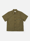 The Olive Recycled Polytech Z Tech Overshirt is shown as a flat lay against a white background. The short-sleeve overshirt features a one-piece collar, a central button-down front, and a single reinforced patch pocket with a zip on the chest. The olive green fabric has a smooth finish and visible stitching details.