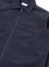 The Navy Seo Recycled Nylon Zip Too Shirt is shown in a detail view as a flat lay against a plain white background. The image highlights the smooth, technical finish of the navy blue recycled nylon fabric and the clean stitching around the zip-front closure.