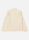 The Stone Seo Recycled Nylon Zip Too Shirt is shown from a rear angle as a flat lay against a plain white background. The image highlights the smooth texture of the stone-colored recycled nylon fabric, the straight hem, and the simple construction of the back panel.