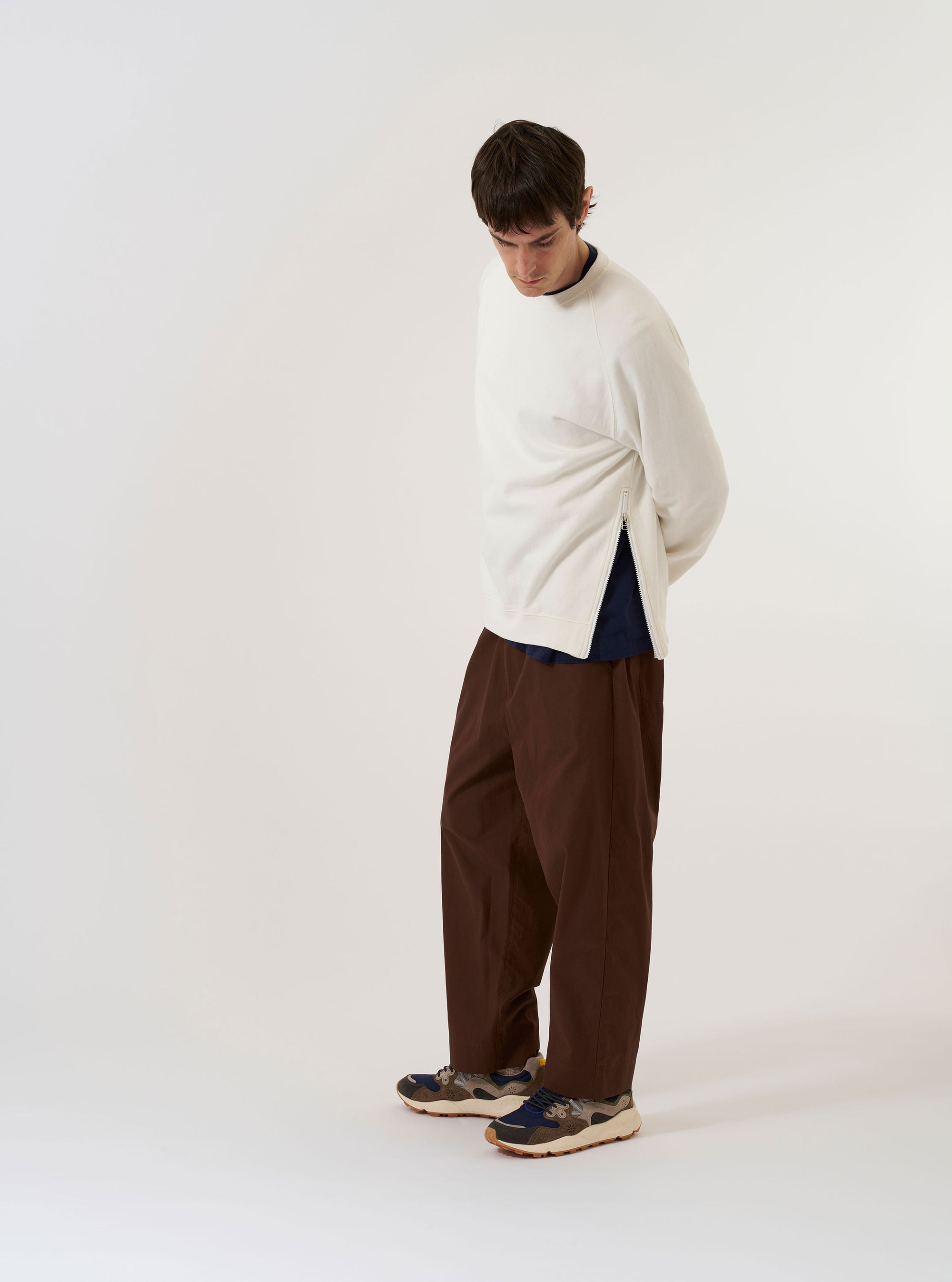 The Ecru Brush Back Sweat Billy Sweat is shown as a flat lay against a plain white background. The sweatshirt features a ribbed crew neckline, long sleeves with ribbed cuffs, and a ribbed hem. The garment is made from a solid ecru-colored brush back sweat fabric.