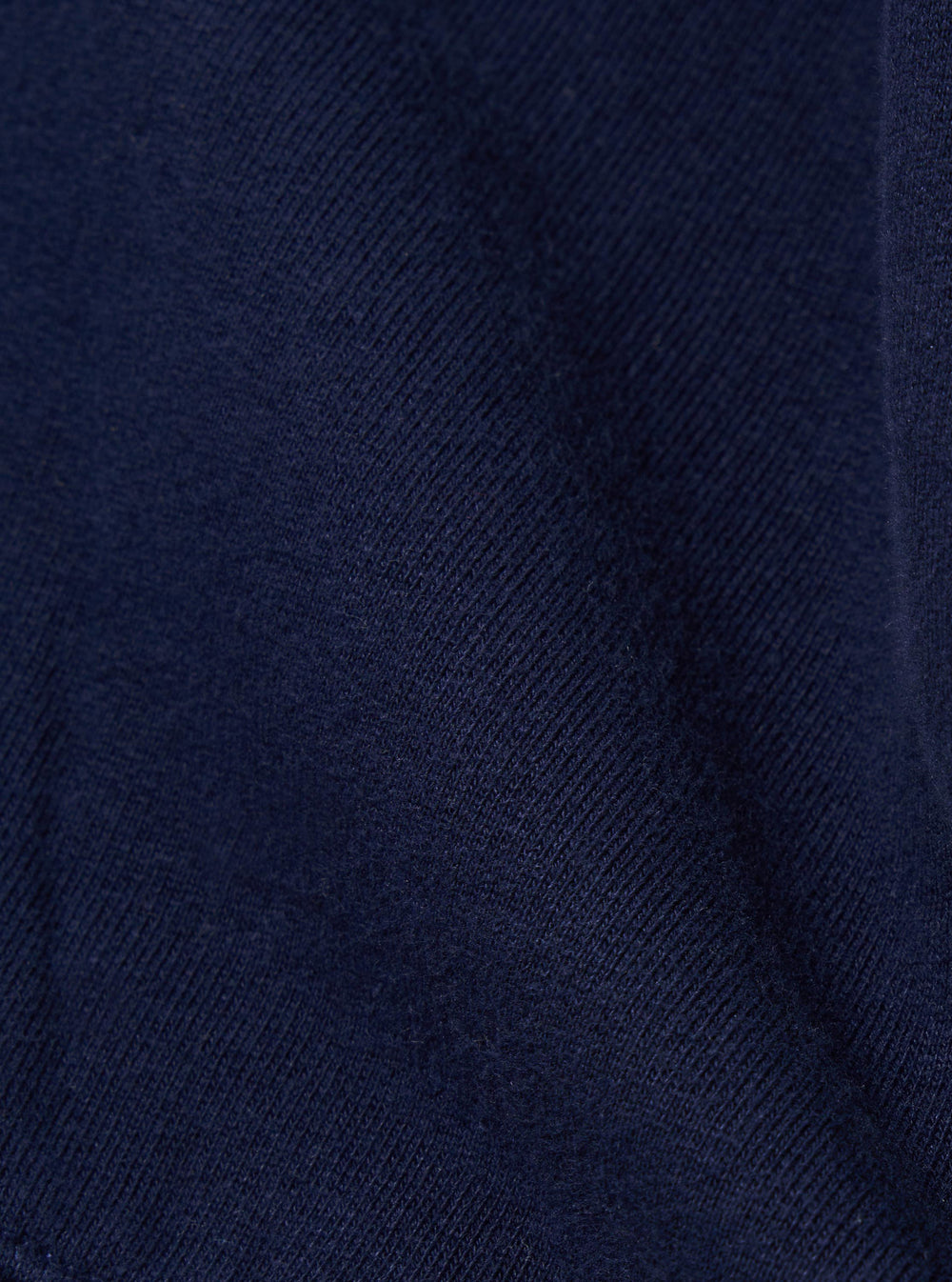 A close-up swatch image of the Navy Brush Back Sweat Billy Sweat fabric displays a deep navy blue color with a soft, matte texture. The brush-back cotton material is shown in detail, filling the frame to highlight the weight and finish of the jersey.