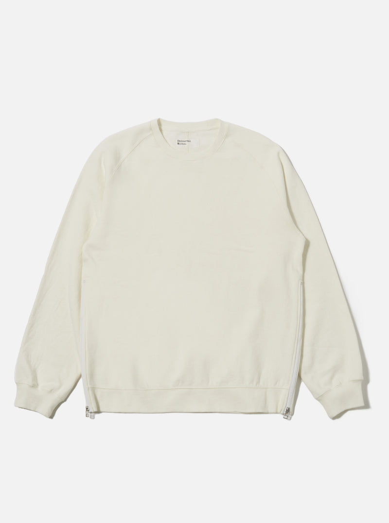 The Ecru Brush Back Sweat Billy Sweat is shown as a flat lay against a plain white background. The sweatshirt features a classic crew neckline, long sleeves with ribbed cuffs, and a ribbed hem. The fabric is a solid ecru cotton with a soft, matte finish.