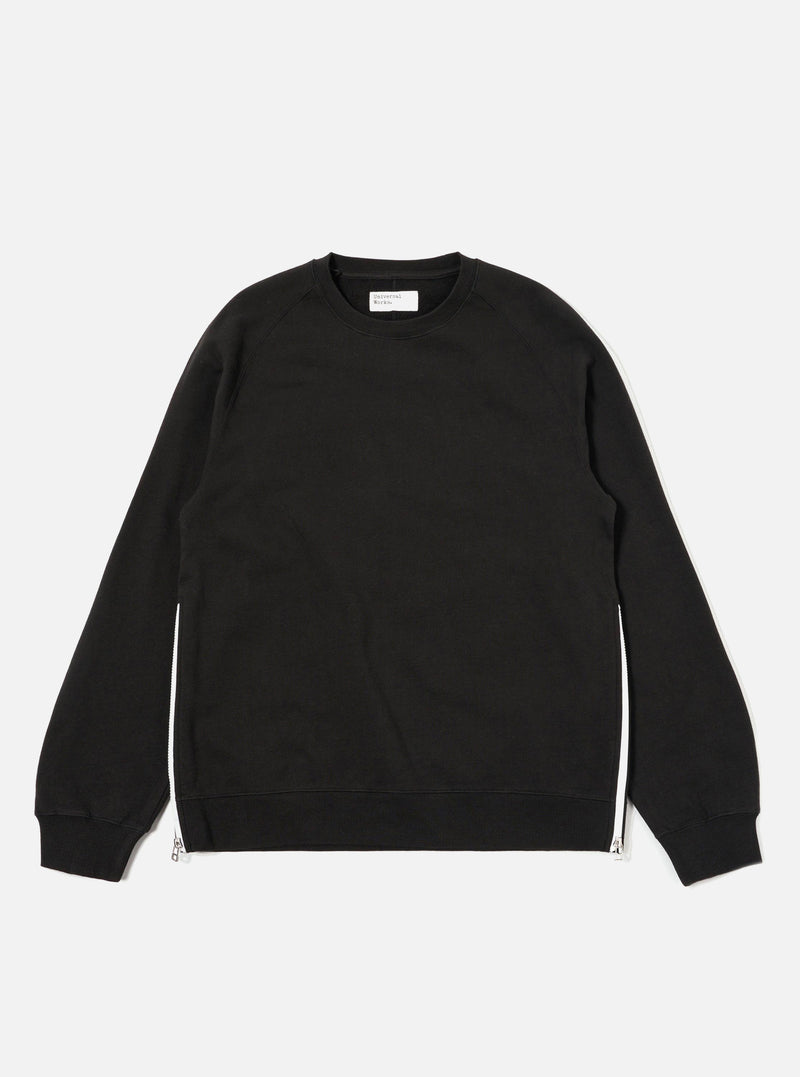The Black Brush Back Sweat Billy Sweat is shown as a flat lay against a plain white background. The sweatshirt features a classic crew neckline, long sleeves with ribbed cuffs, and a ribbed hem. The garment is made from a solid black cotton fabric with a soft, brushed texture.