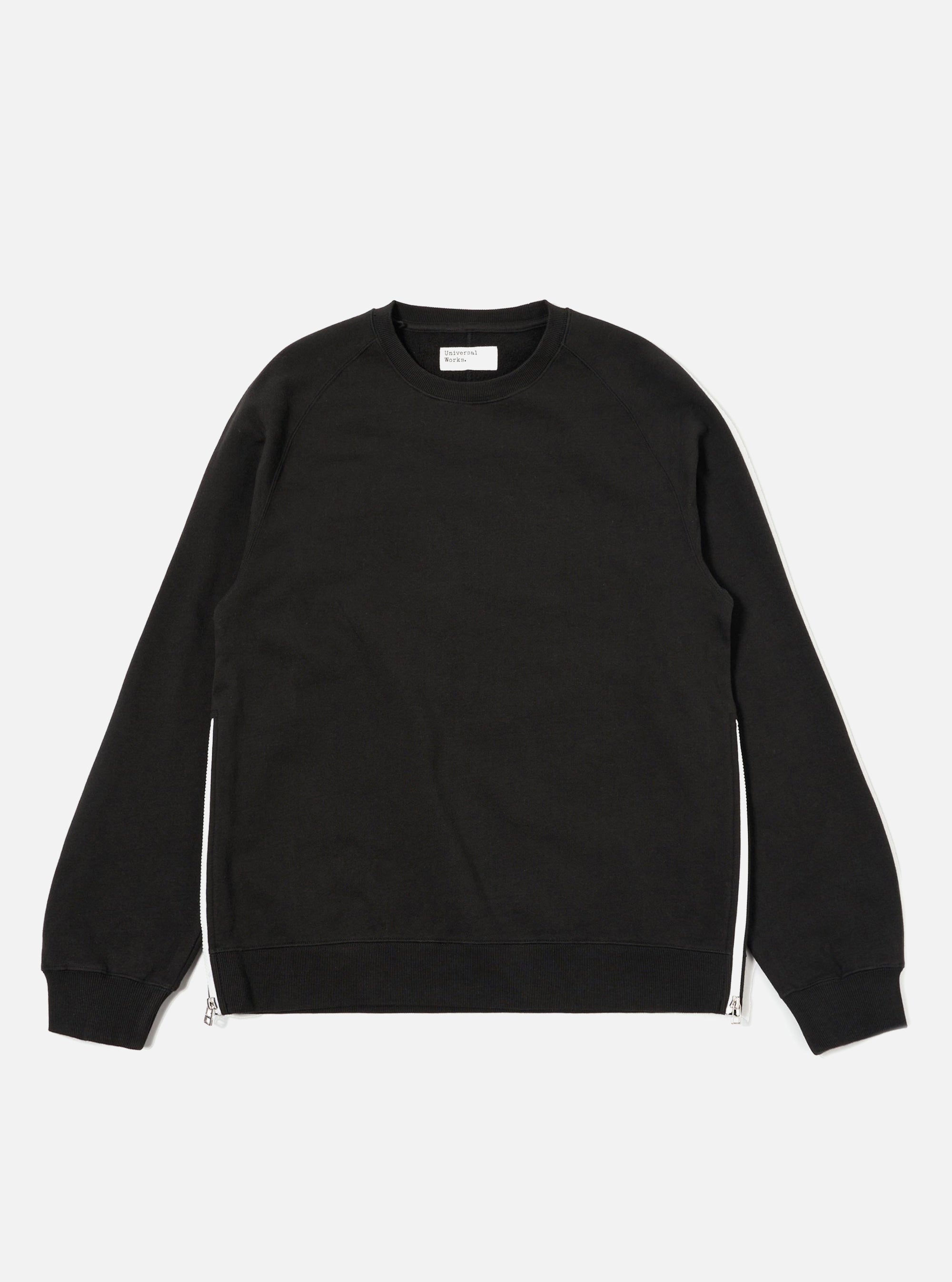 The Black Brush Back Sweat Billy Sweat is shown as a flat lay against a plain white background. The sweatshirt features a classic crew neckline, long sleeves with ribbed cuffs, and a ribbed hem. The garment is made from a solid black cotton fabric with a soft, brushed texture.