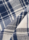 A close-up swatch image of the Navy Texture Plaid Scout Scarf fabric displays a detailed view of the textile. The image features a textured plaid pattern with a navy blue base and intersecting lines. The fabric has a visible weave and a soft, matte finish.