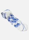 The White Jungle Toile Poplin Tie is shown from the back as a flat lay against a white background. The image highlights the reverse side of the tie, showing the construction, the keeper loop, and the pointed tip. The fabric features a white base with a detailed blue jungle-themed toile print including trees and foliage.
