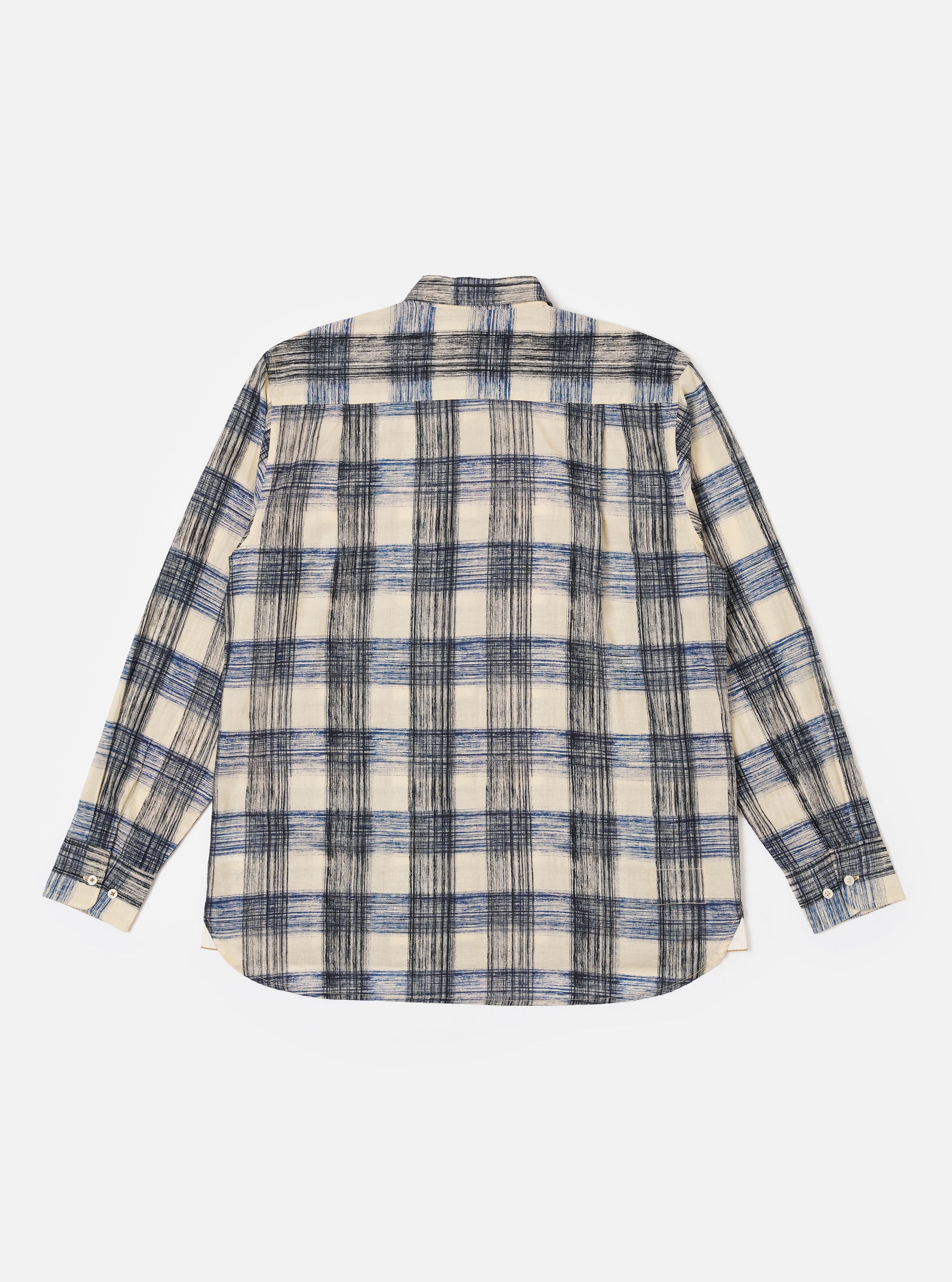 The Navy Window Panes Square Pocket Shirt is shown from the back as a flat lay against a plain white background. The image highlights the all-over white windowpane check pattern on the dark navy cotton fabric, as well as the straight hem and the clean construction of the shoulders and yoke.