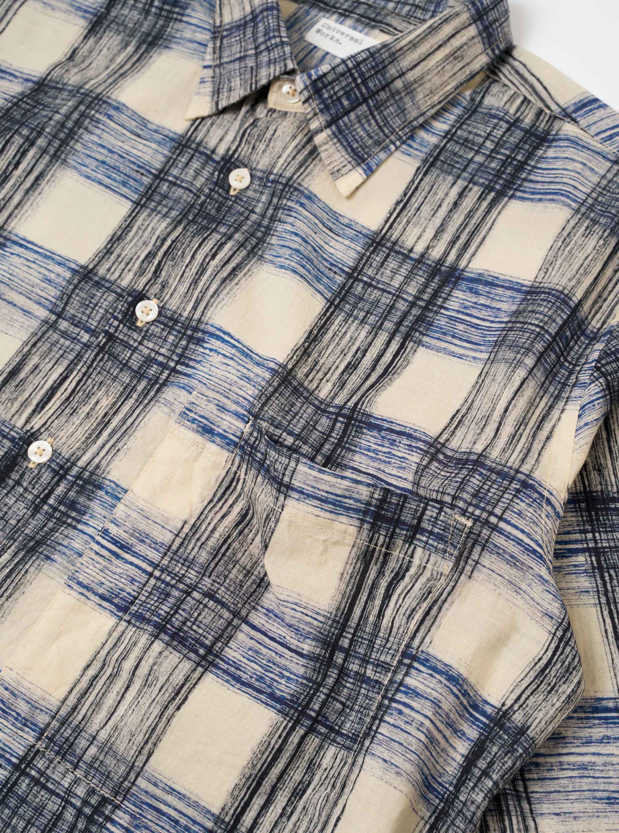 The Navy Window Panes Square Pocket Shirt is shown from a rear angle as a flat lay against a plain white background. The image highlights the shirt's back yoke, the continuous windowpane check pattern, and a straight hem.