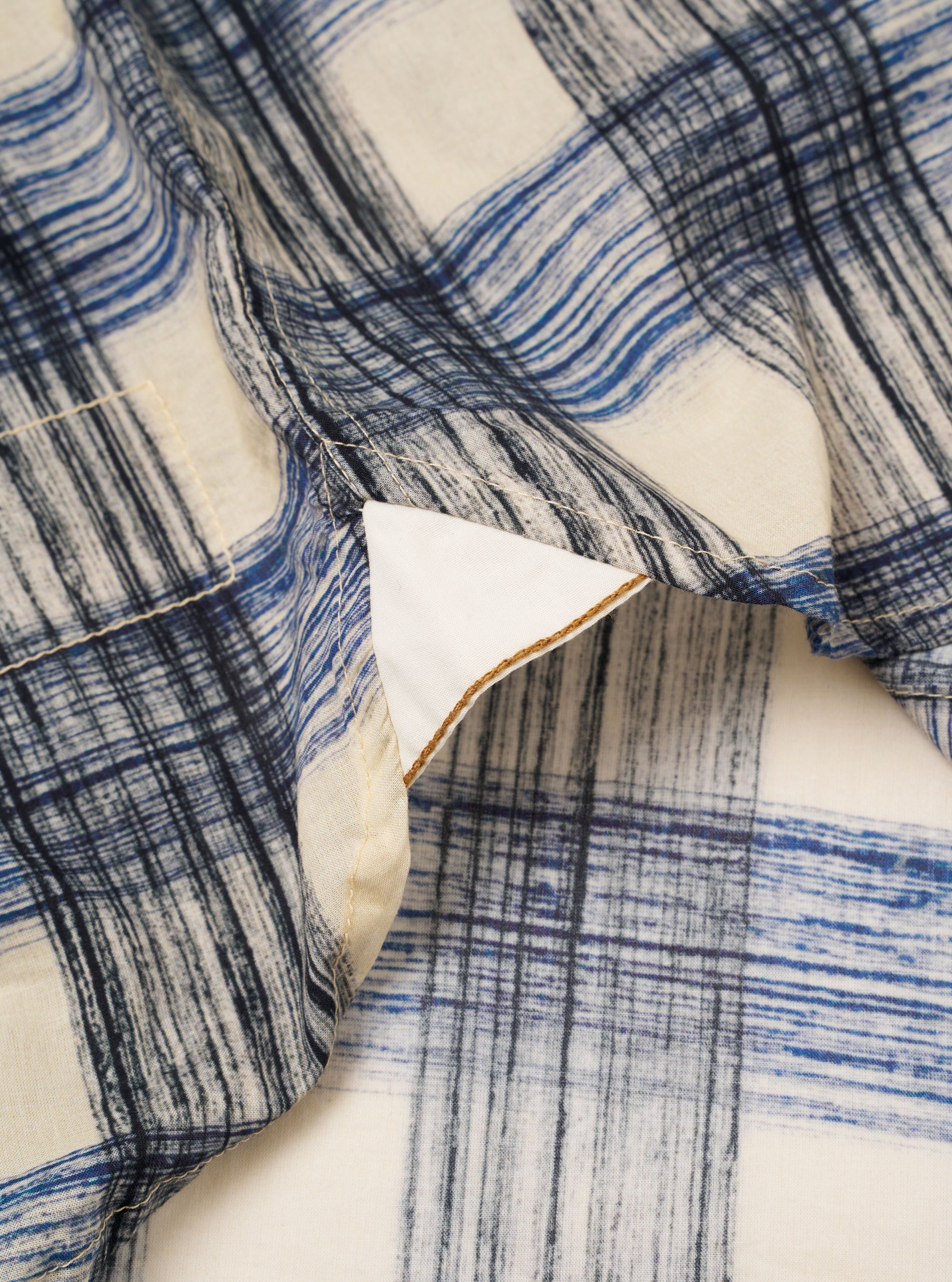 The Navy Window Panes Square Pocket Shirt is shown from the back as a flat lay against a plain white background. The image highlights the shirt's back yoke construction and curved hem. The fabric features a soft navy blue color with a white windowpane check pattern.