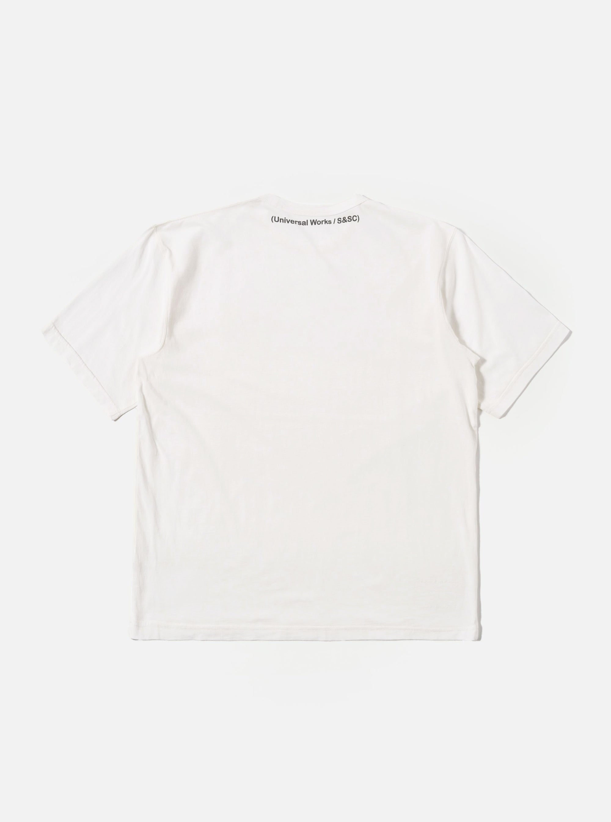 The Ecru Single Jersey 34 Printed Core Tee is shown from the back as a flat lay against a plain white background. The image highlights the clean construction of the t-shirt, featuring a ribbed crewneck, short sleeves, and a straight hem.