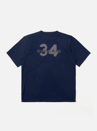 The Navy Single Jersey 34 Printed Core Tee is shown as a flat lay against a plain white background. The short-sleeve t-shirt features a ribbed crew neck and a prominent graphic print on the chest. The garment is constructed from a dark navy cotton jersey fabric with a smooth finish.