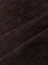 A close-up swatch image of the Brown Diamond Dobby Deck Shirt highlights the intricate textile detail. The brown cotton fabric features a distinct diamond dobby weave, creating a subtle geometric pattern with small raised stitches throughout.