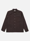 The Brown Diamond Dobby Lucky Shirt is shown as a flat lay against a white background. The shirt features a button-front fastening, a classic collar, and a single patch pocket on the left chest. The brown cotton fabric has a visible textured diamond dobby pattern throughout.