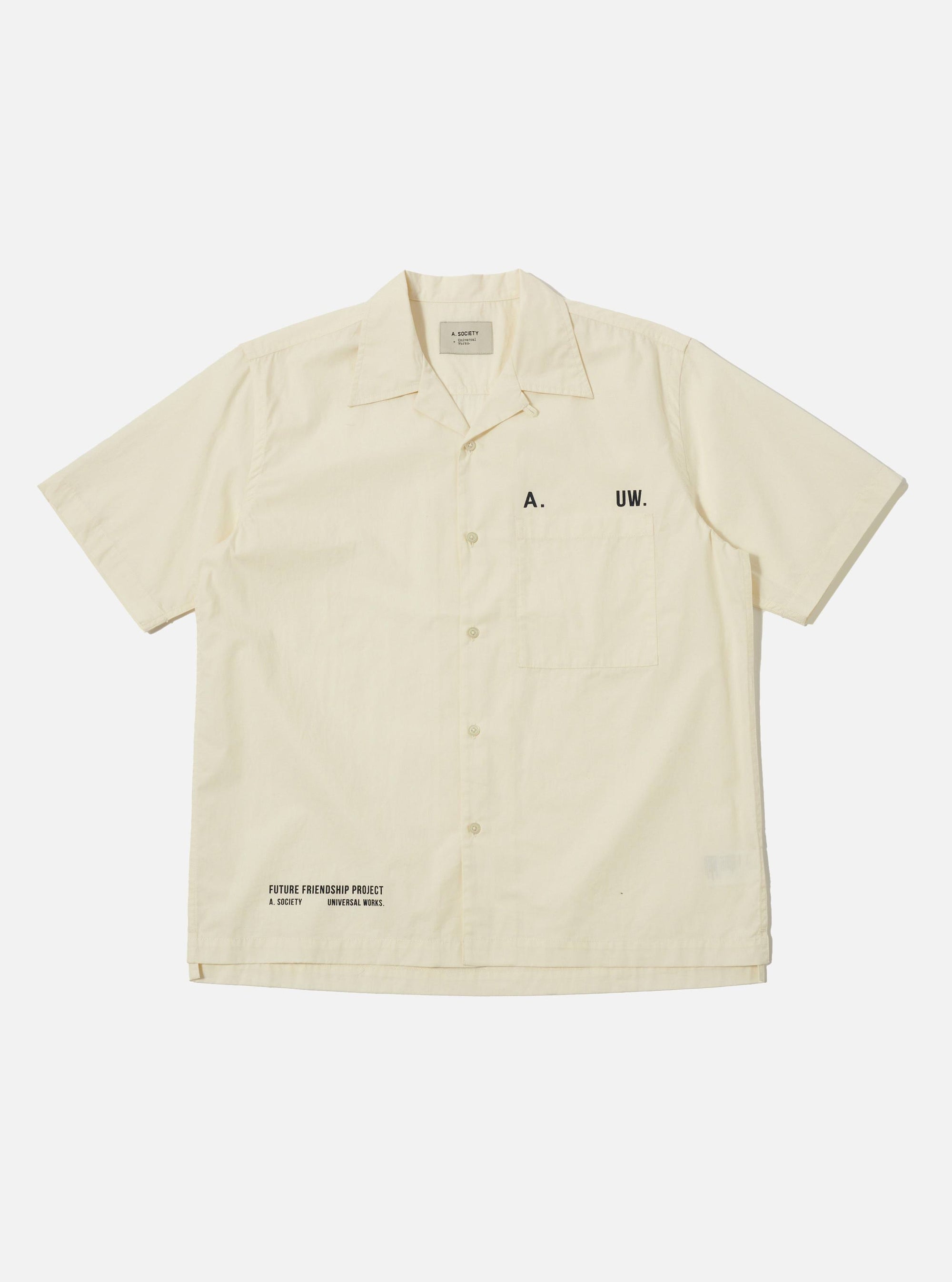 The A. SOCIETY x Universal Works Ecru Broadcloth Camp Shirt is laid flat on a white background. The shirt is a light cream color with short sleeves and a button-up front.