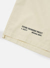 Close-up of the A. SOCIETY x Universal Works Ecru Broadcloth Camp Shirt on a white background. The ecru fabric shows the 'Future Friendship Project' text.