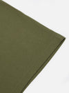 Close-up of the A. SOCIETY x Universal Works Olive Single Jersey Print Tee, showcasing the olive green single jersey material and subtle print detail on a clean white background.