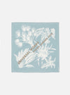 The Pale Blue Cambric Neckerchief is shown as a flat lay against a white background. The neckerchief is folded into a square, highlighting the smooth, fine weave of the light blue cambric cotton fabric and its clean, stitched edges.