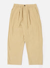 The Sand Organic Fine Cord Oxford Pant is shown as a flat lay against a white background. The trousers feature a wide, loose leg with a single pleat front and an elasticated waistband with a tonal drawstring. The fabric has a fine corduroy texture in a light sand color.