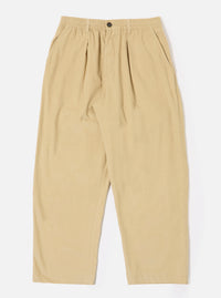 The Sand Organic Fine Cord Oxford Pant is shown as a flat lay against a white background. The trousers feature a wide, loose leg with a single pleat front and an elasticated waistband with a tonal drawstring. The fabric has a fine corduroy texture in a light sand color.