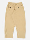 The Sand Organic Fine Cord Oxford Pant is shown from the back as a flat lay against a plain white background. The image highlights the two rear pockets, including one with a buttoned flap and one jetted pocket, as well as the elasticated waistband. The sand-colored organic cotton fabric features a visible fine corduroy texture.