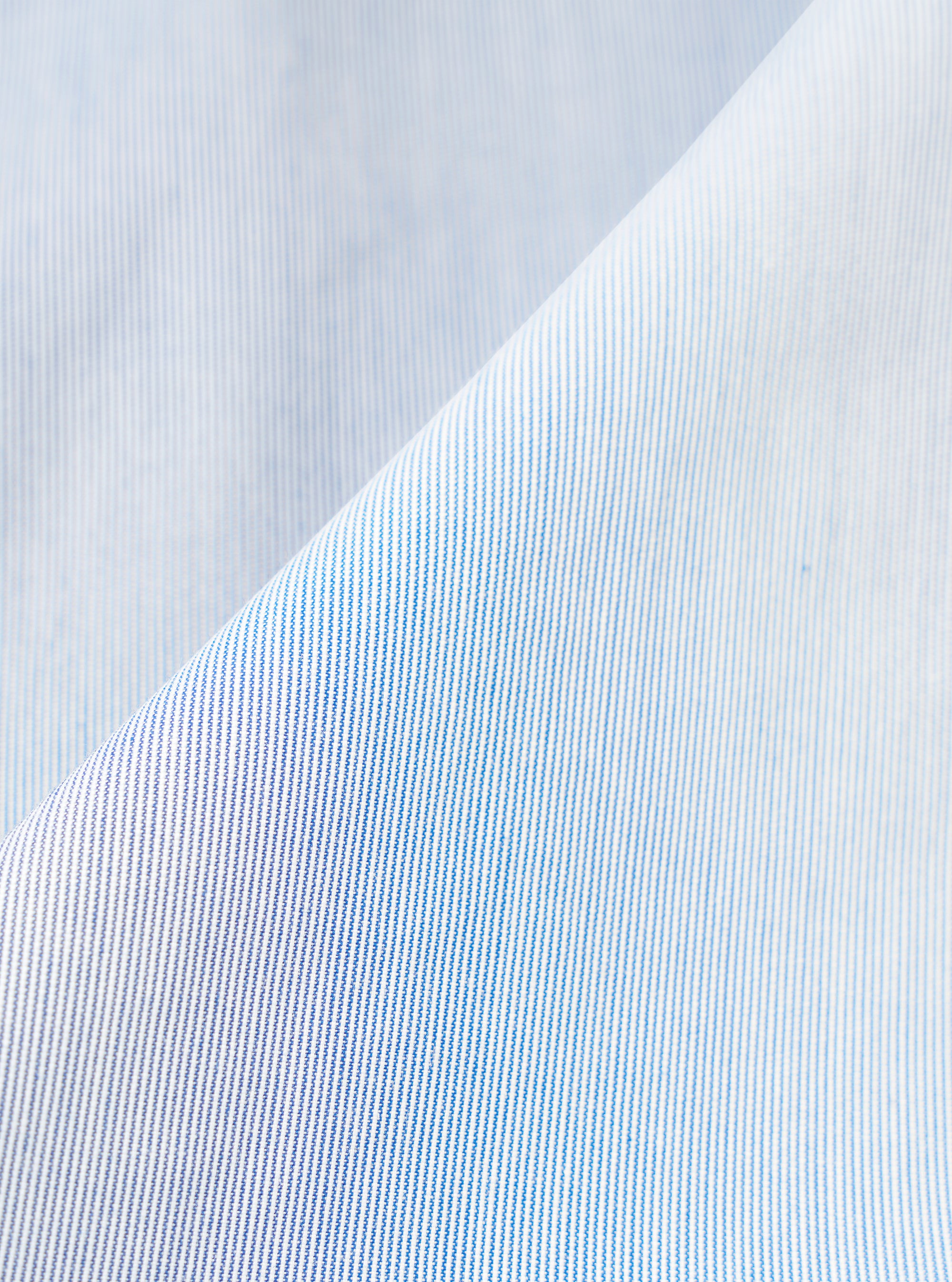 A close-up fabric swatch of the Navy Kennedy Stripe Franck Jacket is shown, highlighting the dark navy blue cotton material and the detailed vertical pinstripe pattern. The texture of the weave fills the frame.