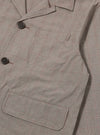 The Grey Brown Wales Glen Check Franck Jacket is shown from the back as a flat lay against a plain white background. The image highlights the straight-cut rear panel and the detailed grey and brown glen check pattern of the cotton fabric.