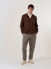 The Brown Peached Poplin Franck Jacket is shown as a flat lay against a white background. The jacket features a one-piece flat collar, two front flap pockets at the hip, and one chest welt pocket. It has a five-button front closure and a regular fit.