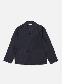The Navy Peached Poplin Franck Jacket is shown as a flat lay against a plain white background. This short-cut chore jacket features a one-piece flat collar, a central button-down closure, two front flap pockets at the waist, and a single welt pocket on the chest. The navy blue cotton fabric has a smooth, peached poplin finish.
