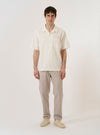 The Brown Kennedy Stripe Military Chino is shown as a flat lay against a plain white background. The trousers feature a straight-leg silhouette with a vertical pinstripe pattern throughout. Prominent details include a button waist closure, belt loops, and two front slant pockets.