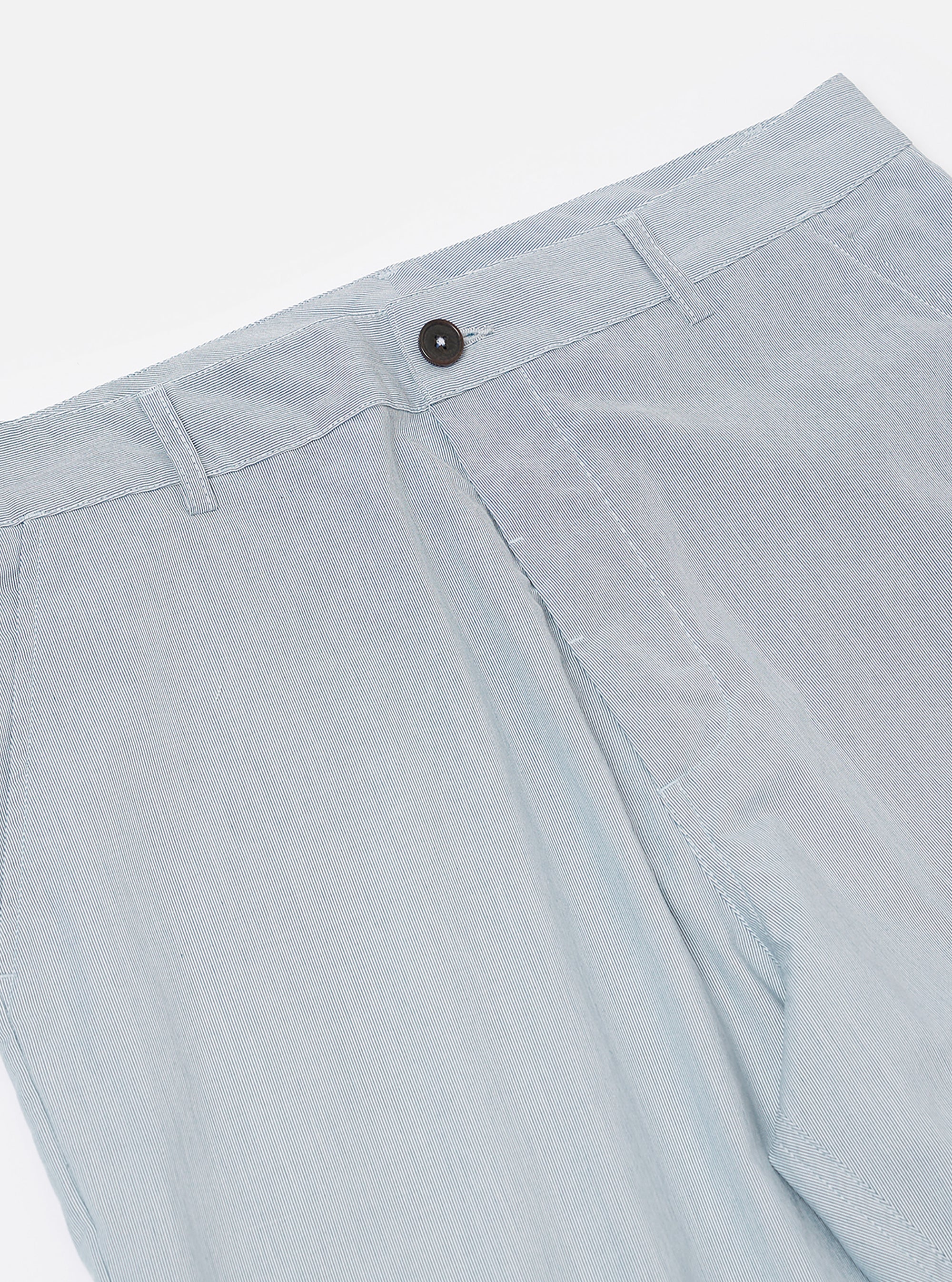 The Navy Kennedy Stripe Military Chino is shown from a rear angle as a flat lay against a plain white background. The image highlights the two rear button-down flap pockets and the straight-leg fit of the trousers. The navy blue fabric features a subtle vertical Kennedy stripe pattern throughout.