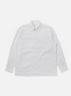 The White Seersucker Double Lucky Shirt is shown as a flat lay against a white background. The shirt features a classic button-down collar, a full-length button placket, and a single chest pocket. The fabric is made of a lightweight white cotton with a distinctive puckered seersucker texture.