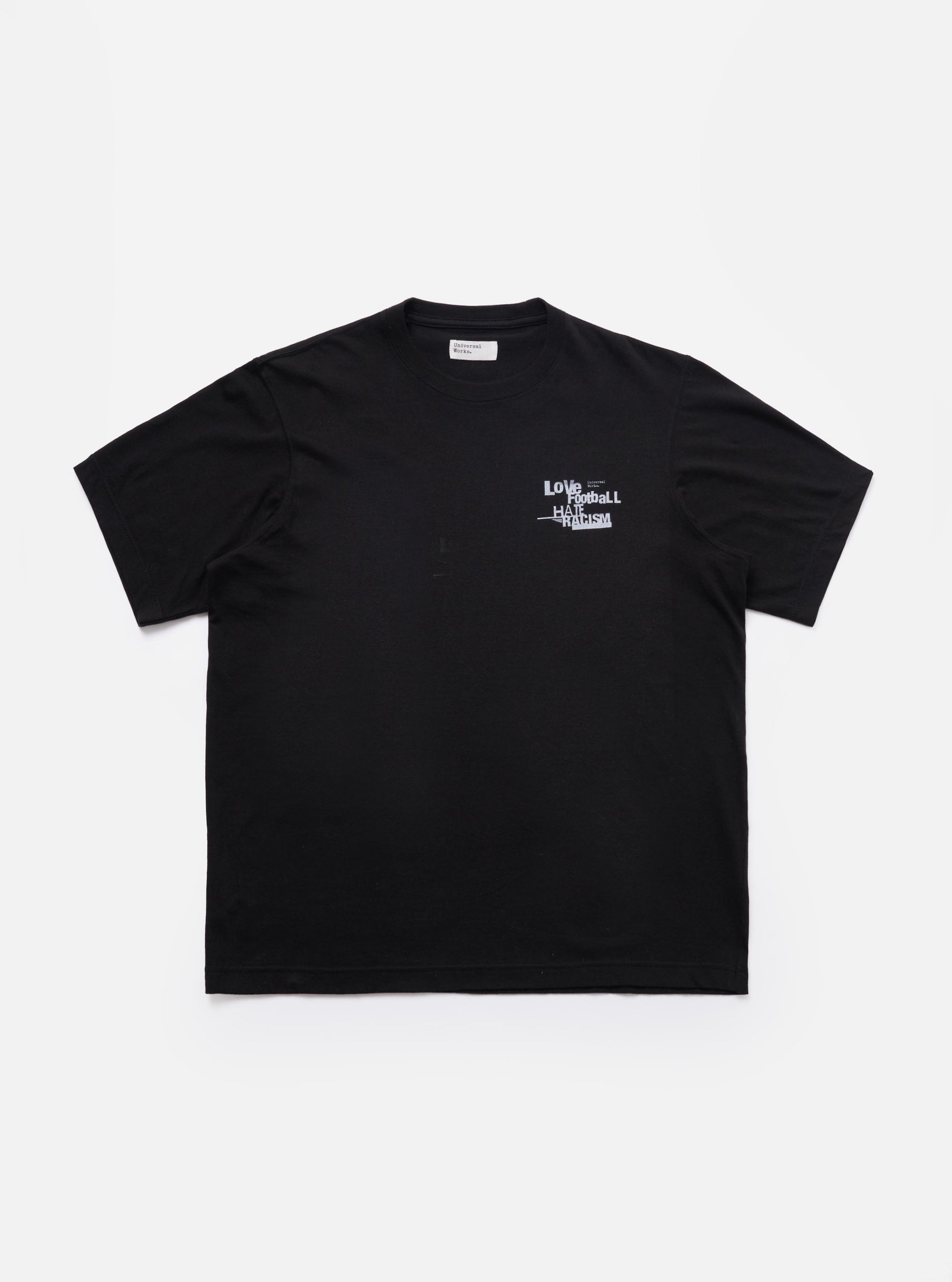 The Black Love Football Jersey Print Tee is shown as a flat lay against a white background. The t-shirt features a white graphic print on the center chest with the word Love written in a stylized, athletic-style font. It has a classic crew neckline and short sleeves.
