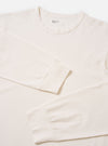 The Antique White Recycled/Bio Jersey Henry L/S Tee is shown from a rear angle as a flat lay against a plain white background. The image highlights the clean construction of the shoulders, the long sleeves, and the straight hem. The jersey fabric is a solid antique white color with a soft, smooth texture.