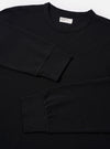 The Black Recycled/Bio Jersey Henry L/S Tee is shown from the back as a flat lay against a plain white background. The image highlights the clean construction of the long-sleeved t-shirt, featuring a straight hem and a simple crew neckline. The fabric is a solid black jersey.