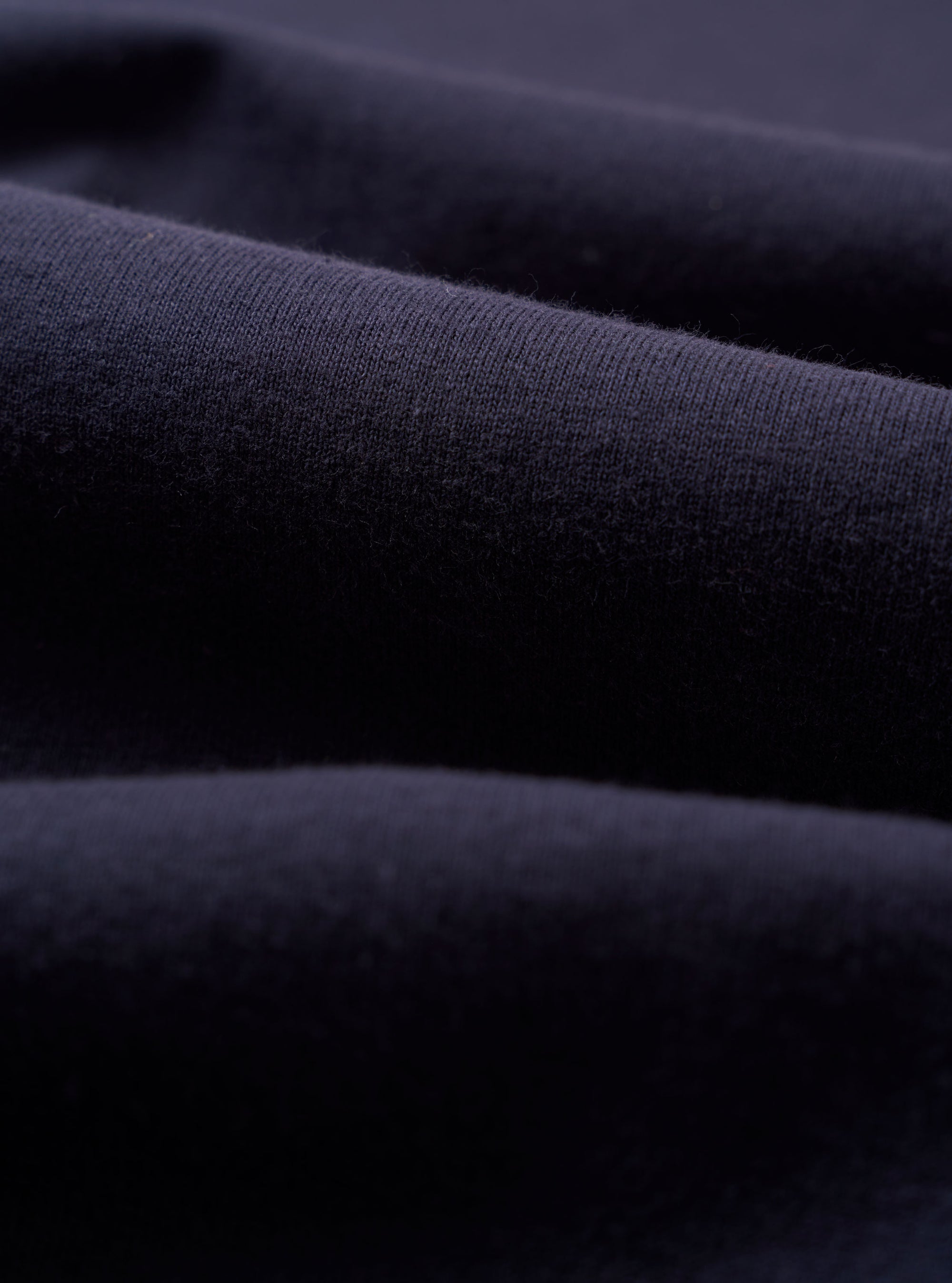A close-up swatch image of the Navy Recycled/Bio Jersey Henry L/S Tee fabric. The image focuses on the textile detail, showing a deep navy blue color with a soft, uniform jersey knit texture.