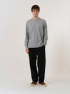 The Grey Marl Recycled/Bio Jersey Henry L/S Tee is shown as a flat lay against a white background. The long-sleeve T-shirt features a crew neckline, a straight hem, and a small logo patch near the hem on the left side. The fabric has a textured grey marl appearance.