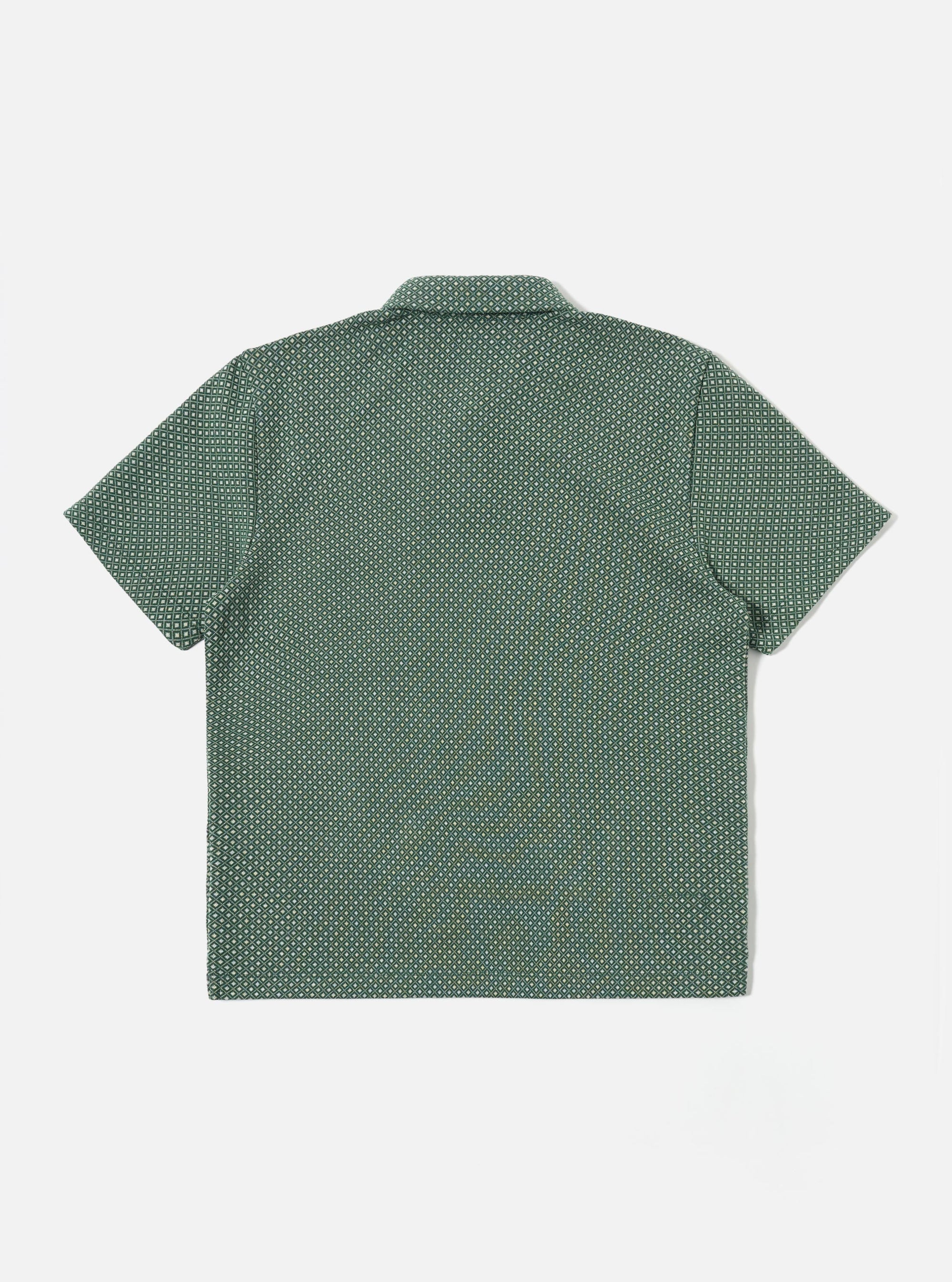 The Green Argyll Jersey Newlyn Polo is shown as a flat lay against a white background. The polo shirt features a green and white argyll diamond pattern, a three-button placket, a classic collar, and short sleeves.