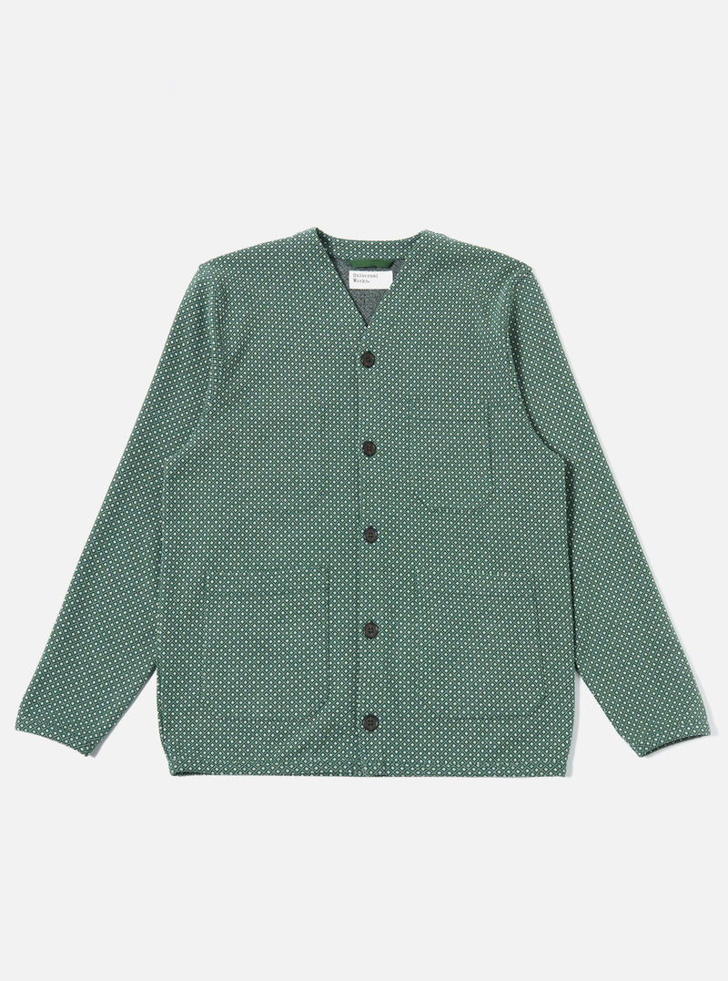 The Green Argyll Jersey Cardigan is shown as a flat lay against a plain white background. The garment features an all-over argyle pattern in shades of green and dark tones, a V-neckline, and a five-button front closure. The sleeve cuffs and hem are finished with a solid green ribbed trim.