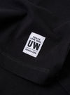 The Black Recycled/Bio Jersey Core Pocket Tee is shown from the back as a flat lay against a plain white background. The image highlights the simple, clean construction of the garment's rear, featuring short sleeves and a straight hem. The fabric is a smooth black jersey made from a blend of recycled and organic cotton.