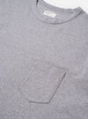 The Grey Marl Recycled/Bio Jersey Core Pocket Tee is shown from the back as a flat lay against a plain white background. The image highlights the clean construction and the soft, heathered texture of the grey marl jersey fabric. The T-shirt features a classic crew neckline, short sleeves, and a straight hem.