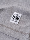 The Grey Marl Recycled/Bio Jersey Core Pocket Tee is shown from a rear angle as a flat lay against a plain white background. The image highlights the clean construction of the t-shirt's back, featuring a straight hem and short sleeves. The fabric has a soft, grey marl jersey texture.