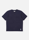 The Navy Recycled/Bio Jersey Core Pocket Tee is shown as a flat lay against a white background. The t-shirt features a classic crew neck, short sleeves, and a single patch pocket on the left chest. The fabric is a smooth, dark navy jersey.