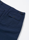 The Navy Derby Stripe Clean Short is shown from the back as a flat lay against a plain white background. The shorts feature a vertical navy and white stripe pattern, an elasticated waistband, and a single rear patch pocket on the right side. The fabric is a crisp cotton with a visible vertical stripe texture.