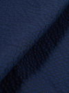 A close-up fabric swatch of the Navy Derby Stripe Clean Short highlights the vertical navy blue and white stripe pattern. The image provides a detailed view of the cotton fabric's weave and texture.