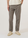 A model wears the Multi Lucas Cotton Mix Military Chino, shown from the waist down against a plain, neutral background. These trousers feature a straight-leg fit and a distinct multi-colored check pattern. The model is standing with one hand in a side pocket, highlighting the garment's functional design and the textured cotton-mix fabric. No mannequin is present in the image.